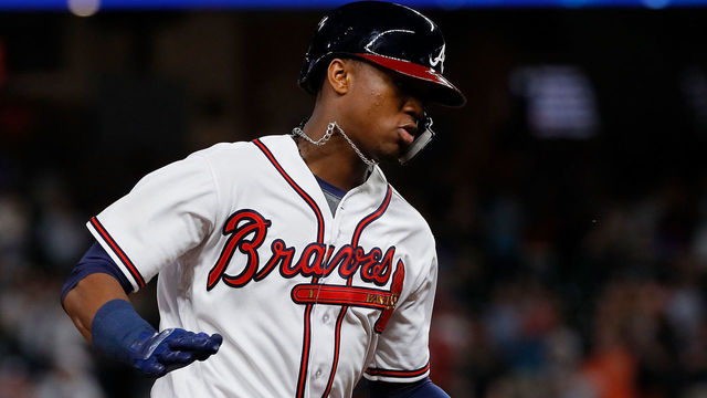 ATLANTA, GA - MAY 15: Ronald Acuna Jr. #13 of the Atlanta Braves rounds third base after hitting a solo homer in the eighth inning against the Chicago Cubs at SunTrust Park on May 15, 2018 in Atlanta, Georgia.