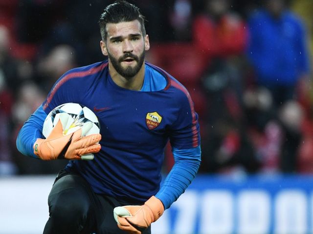 Roma's Brazilian goalkeeper Alisson warms up before the UEFA Champions League first leg semi-final football match between Liverpool and Roma at Anfield stadium in Liverpool, north west England on April 24, 2018.