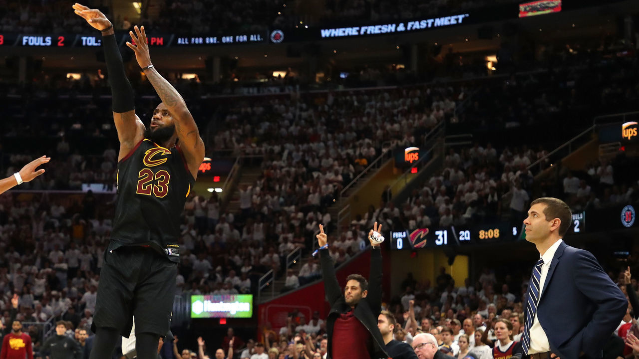 CLEVELAND, OH - MAY 25: LeBron James of the Cleveland Cavaliers shoots against Marcus Morris of the Boston Celtics in the second quarter as head coach Brad Stevens of the Boston Celtics looks on during Game Six of the 2018 NBA Eastern Conference Finals at Quicken Loans Arena on May 25, 2018 in Cleveland, Ohio.