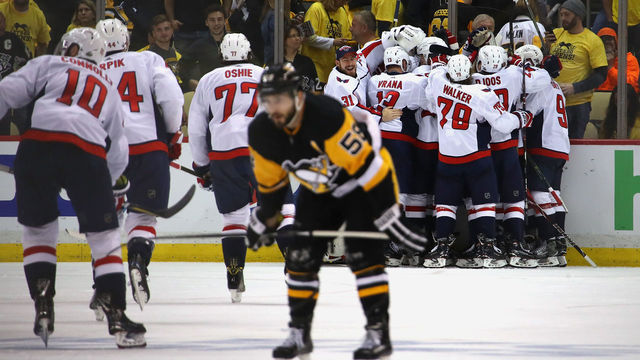 PITTSBURGH, PA - MAY 07: The Washington Capitals celebrate moving on to the Eastern Conference Finals after a 2-1 overtime win behind Kris Letang #58 of the Pittsburgh Penguins in Game Six of the Eastern Conference Second Round during the 2018 NHL Stanley Cup Playoffs at PPG Paints Arena on May 7, 2018 in Pittsburgh, Pennsylvania.