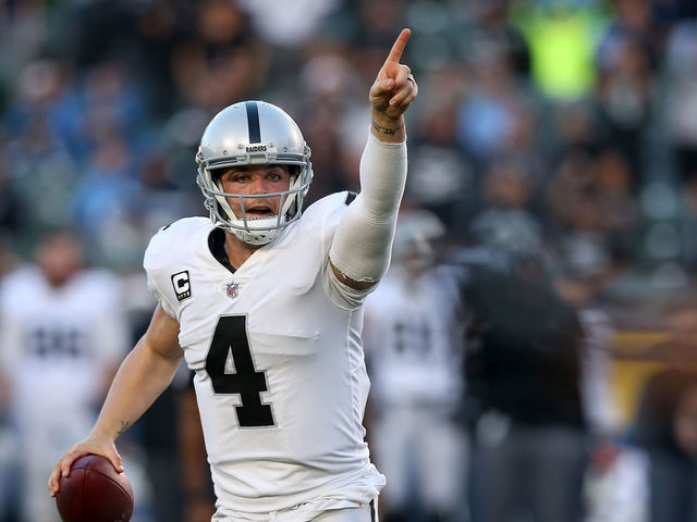 CARSON, CA - DECEMBER 31: Derek Carr #4 of the Oakland Raiders directs his team before throwing the ball during the second half of the game against the Los Angeles Chargers at StubHub Center on December 31, 2017 in Carson, California.