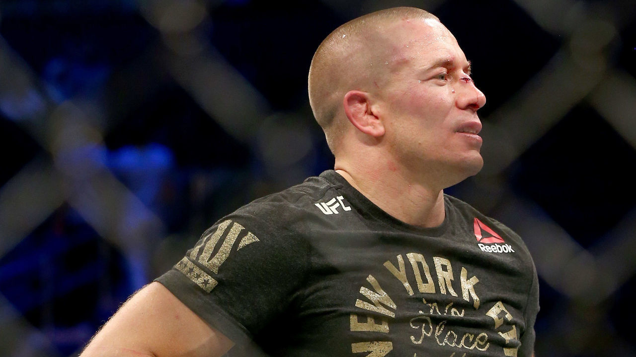 NEW YORK, NY - NOVEMBER 04: Georges St-Pierre of Canada accepts his championship belt after defeating Michael Bisping of England in their UFC middleweight championship bout during the UFC 217 event at Madison Square Garden on November 4, 2017 in New York City.