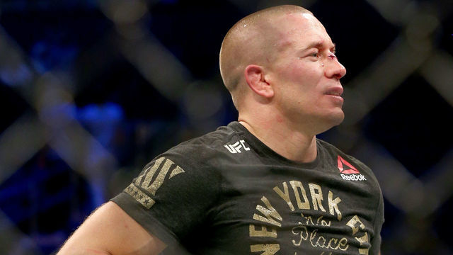 NEW YORK, NY - NOVEMBER 04: Georges St-Pierre of Canada accepts his championship belt after defeating Michael Bisping of England in their UFC middleweight championship bout during the UFC 217 event at Madison Square Garden on November 4, 2017 in New York City.