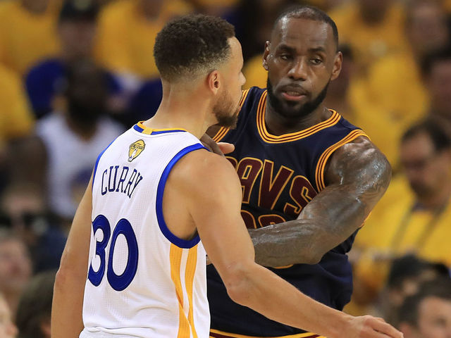 OAKLAND, CA - JUNE 01: Stephen Curry #30 of the Golden State Warriors and LeBron James #23 of the Cleveland Cavaliers battle for position during the first half of Game 1 of the 2017 NBA Finals at ORACLE Arena on June 1, 2017 in Oakland, California.