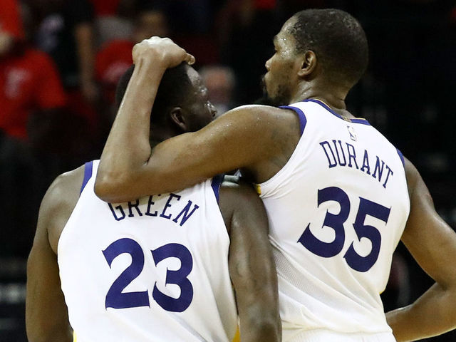 HOUSTON, TX - MAY 28: Draymond Green #23 and Kevin Durant #35 of the Golden State Warriors react in the fourth quarter of Game Seven of the Western Conference Finals of the 2018 NBA Playoffs against the Houston Rockets at Toyota Center on May 28, 2018 in Houston, Texas.