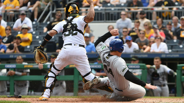 PITTSBURGH, PA - MAY 28: Anthony Rizzo #44 of the Chicago Cubs is forced out at home plate as he slides into the feet of Elias Diaz #32 of the Pittsburgh Pirates in the eighth inning during the game at PNC Park on May 28, 2018 in Pittsburgh, Pennsylvania. MLB players across the league are wearing special uniforms to commemorate Memorial Day.