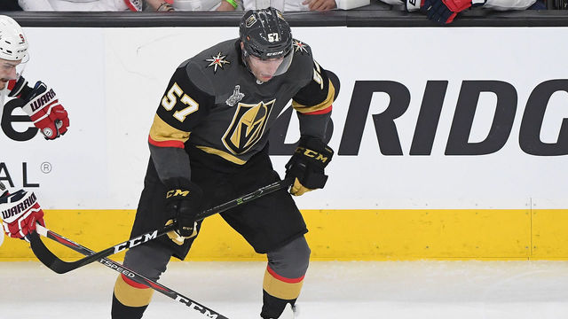 LAS VEGAS, NV - MAY 28: Dmitry Orlov #9 of the Washington Capitals and David Perron #57 of the Vegas Golden Knights battle for the puck in front of fans wearing Elvis costumes in Game One of the 2018 NHL Stanley Cup Final at T-Mobile Arena on May 28, 2018 in Las Vegas, Nevada.