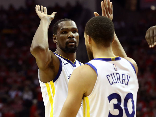 HOUSTON, TX - MAY 14: Kevin Durant #35 and Stephen Curry #30 of the Golden State Warriors react after a play in the third quarter against the Houston Rockets in Game One of the Western Conference Finals of the 2018 NBA Playoffs at Toyota Center on May 14, 2018 in Houston, Texas.