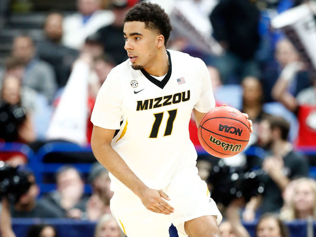 ST LOUIS, MO - MARCH 08: Jontay Porter #11 of the Missouri Tigers dribbles the ball against the Georgia Bulldogs during the second round of the 2018 SEC Basketball Tournament at Scottrade Center on March 8, 2018 in St Louis, Missouri.