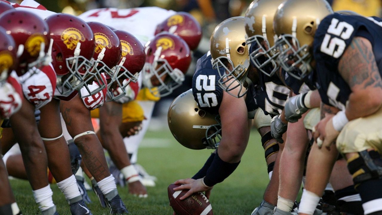 SOUTH BEND, IN - OCTOBER 17: Braxston Cave #52 of the Notre Dame Fighting Irish prepares to snap the ball against the USC Trojans during the second quarter at Notre Dame Stadium on October 17, 2009 in South Bend, Indiana.