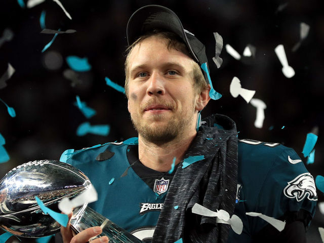 MINNEAPOLIS, MN - FEBRUARY 04: Nick Foles #9 of the Philadelphia Eagles celebrates with the Lombardi Trophy after defeating the New England Patriots 41-33 in Super Bowl LII at U.S. Bank Stadium on February 4, 2018 in Minneapolis, Minnesota.