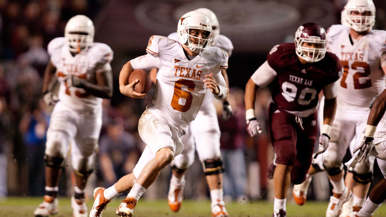 COLLEGE STATION, TX - NOVEMBER 24: Case McCoy #6 of the Texas Longhorns rushes against the Texas A&M Aggies in the second half of a game at Kyle Field on November 24, 2011 in College Station, Texas.