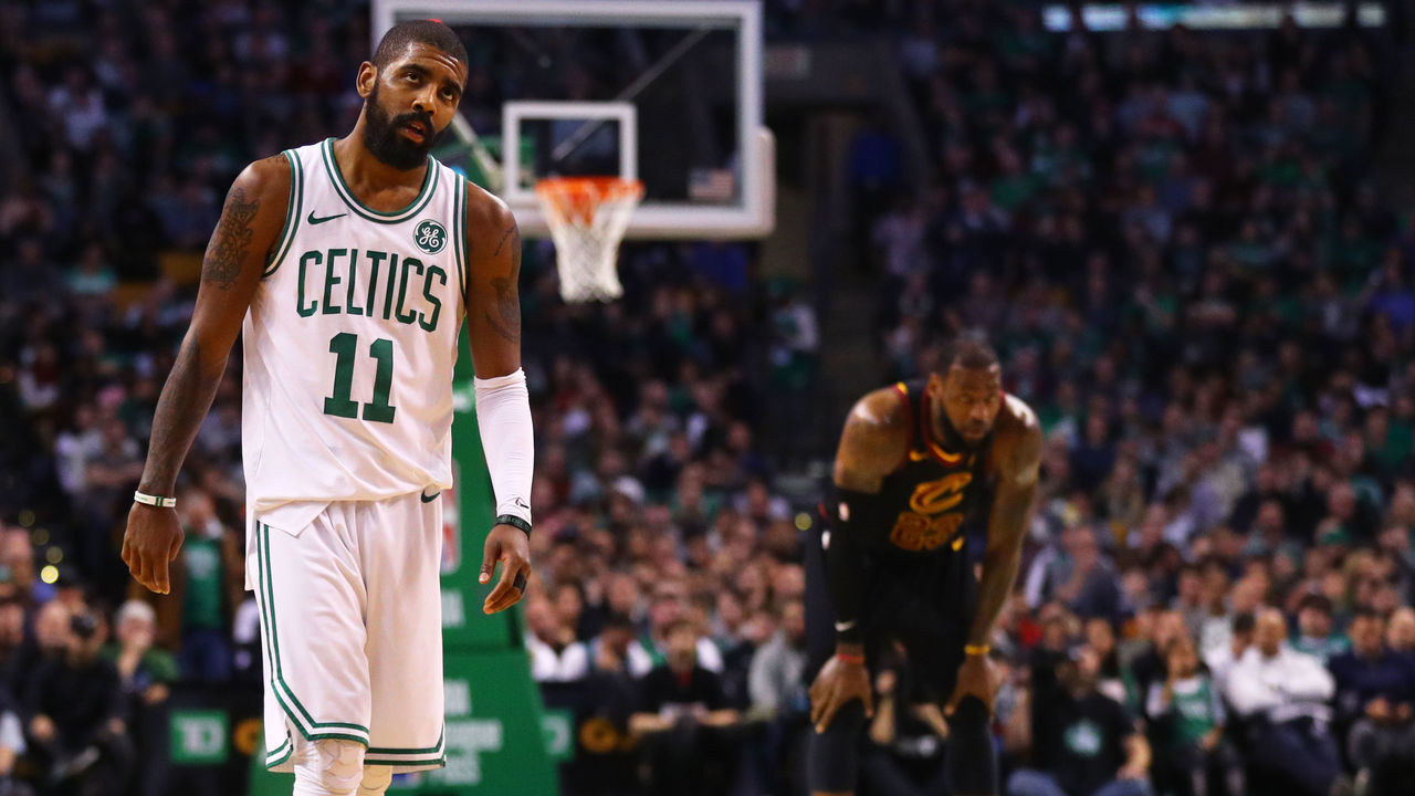BOSTON, MA - JANUARY 3: LeBron James #23 of the Cleveland Cavaliers and Kyrie Irving #11 of the Boston Celtics look on during the second half at TD Garden on January 3, 2018 in Boston, Massachusetts.