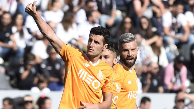 Porto's Spanish defender Ivan Marcano (L) celebrates with teammates after scoring a goal during the Portuguese league football match between Vitoria SC and FC Porto at the Afonso Henriques stadium in Guimaraes, on May 12, 2018.