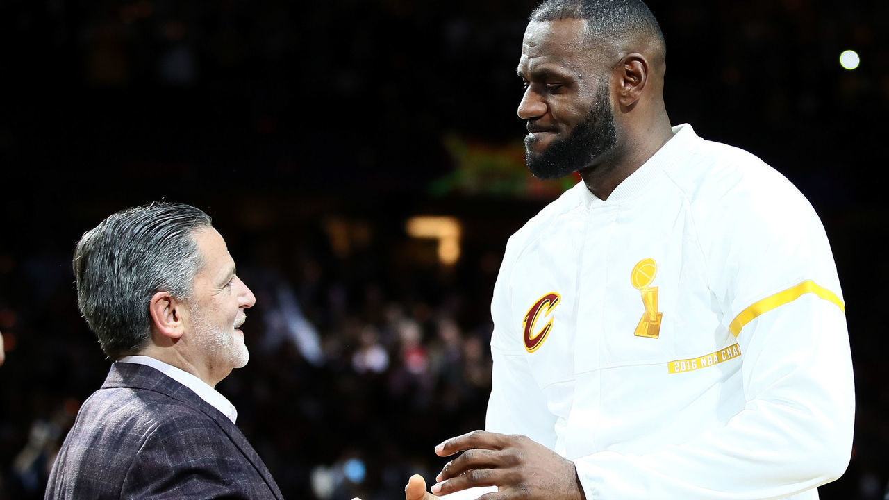 CLEVELAND, OH - OCTOBER 25: LeBron James #23 of the Cleveland Cavaliers recieves his championship ring from owner Dan Gilbert before the game against the New York Knicks at Quicken Loans Arena on October 25, 2016 in Cleveland, Ohio.
