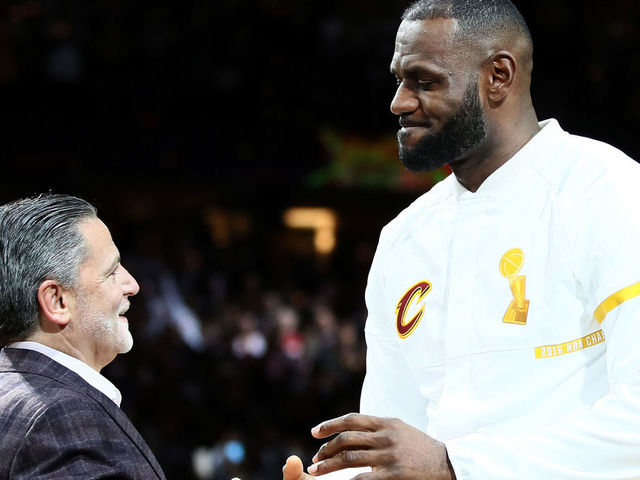 CLEVELAND, OH - OCTOBER 25: LeBron James #23 of the Cleveland Cavaliers recieves his championship ring from owner Dan Gilbert before the game against the New York Knicks at Quicken Loans Arena on October 25, 2016 in Cleveland, Ohio.