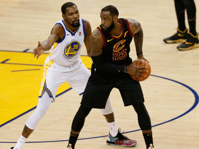 OAKLAND, CA - MAY 31: LeBron James #23 of the Cleveland Cavaliers defended by Kevin Durant #35 of the Golden State Warriors in Game 1 of the 2018 NBA Finals at ORACLE Arena on May 31, 2018 in Oakland, California.