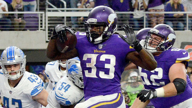 MINNEAPOLIS, MN - OCTOBER 1: Dalvin Cook #33 of the Minnesota Vikings scores a five yard rushing touchdown in the second quarter of the game against the Detroit Lions on October 1, 2017 at U.S. Bank Stadium in Minneapolis, Minnesota.