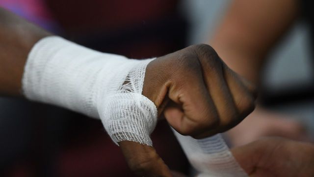 French boxer Hassan NDam gets his fists taped during a training session before his upcoming IBF middlesweight world title bout against Canadian David Lemieux, at the Rock Boxing Gym in Carson, California on June 11, 2015. N'Dam who has a professional record of 30 Wins (17 Knockouts),1 Loss, 0 Draws will fight the Canadian in Montreal on June 20. AFP PHOTO / MARK RALSTON