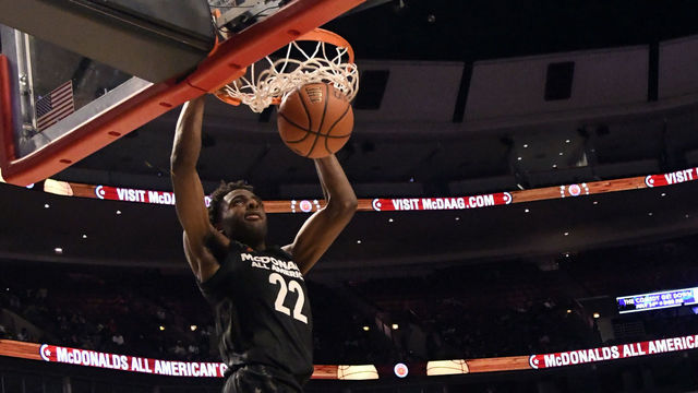 CHICAGO, IL - MARCH 29: Mitchell Robinson #22 of the boys east team dunks the ball during the 2017 McDonalds's All American Game on March 29, 2017 at the United Center in Chicago, Illinois. The West Team won 109-107.