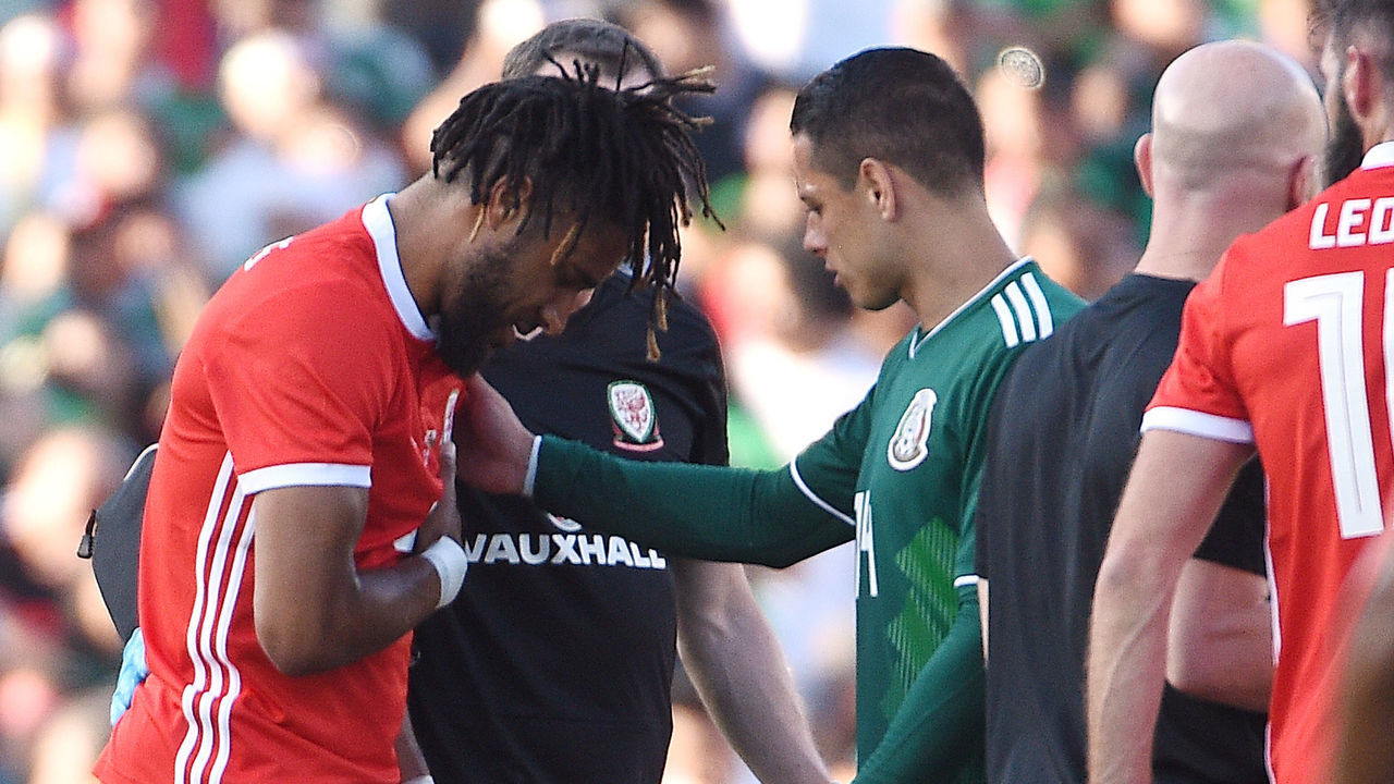 PASADENA, CA - MAY 28: Ashley Williams #6 of Wales is consoled by Javier Hernandez of Mexico as he walks off the pitch following an injury during the first half of their friendly international soccer match at the Rose Bowl on May 28, 2018 in Pasadena, California.
