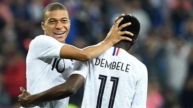 France's foward Kylian Mbappe (L) reacts with France's foward Ousmane Dembele during the friendly football match between France and Italy at the Allianz Riviera stadium in Nice, southeastern France on June 1, 2018.