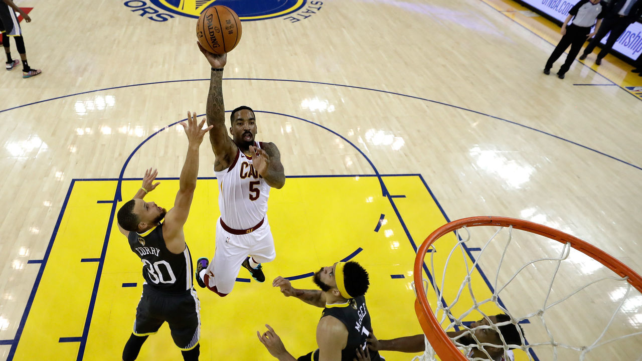 OAKLAND, CA - JUNE 03: JR Smith #5 of the Cleveland Cavaliers attempts a layup over Stephen Curry #30 of the Golden State Warriors in Game 2 of the 2018 NBA Finals at ORACLE Arena on June 3, 2018 in Oakland, California.