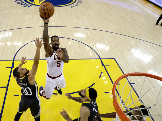OAKLAND, CA - JUNE 03: JR Smith #5 of the Cleveland Cavaliers attempts a layup over Stephen Curry #30 of the Golden State Warriors in Game 2 of the 2018 NBA Finals at ORACLE Arena on June 3, 2018 in Oakland, California.