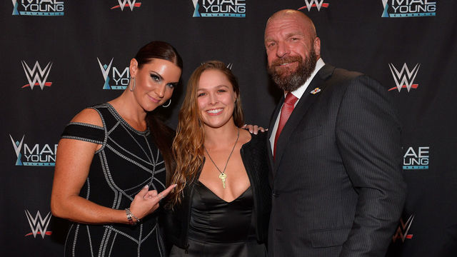 LAS VEGAS, NV - SEPTEMBER 12: (L-R) WWE Chief Brand Officer Stephanie McMahon, MMA fighter Ronda Rousey and WWE Executive Vice President of Talent, Live Events and Creative Paul 'Triple H' Levesque appear on the red carpet of the WWE Mae Young Classic on September 12, 2017 in Las Vegas, Nevada.