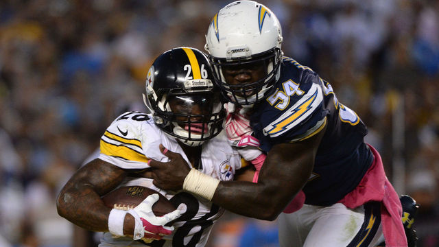 SAN DIEGO, CA - OCTOBER 12: Running back Le'Veon Bell #26 of the Pittsburgh Steelers is tackled by outside linebacker Melvin Ingram #54 of the San Diego Chargers at Qualcomm Stadium on October 12, 2015 in San Diego, California.
