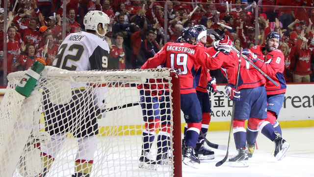 WASHINGTON, DC - JUNE 04: T.J. Oshie #77 of the Washington Capitals is congratulated by his teammates after scoring a first-period goal as Tomas Nosek #92 of the Vegas Golden Knights reacts in Game Four of the 2018 NHL Stanley Cup Final at Capital One Arena on June 4, 2018 in Washington, DC.