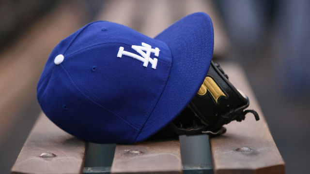 DENVER, CO - MAY 01: Detail photo of a cap and glove of a player from the Los Angeles Dodgers prior to facing the Colorado Rockies at Coors Field on May 1, 2012 in Denver, Colorado.