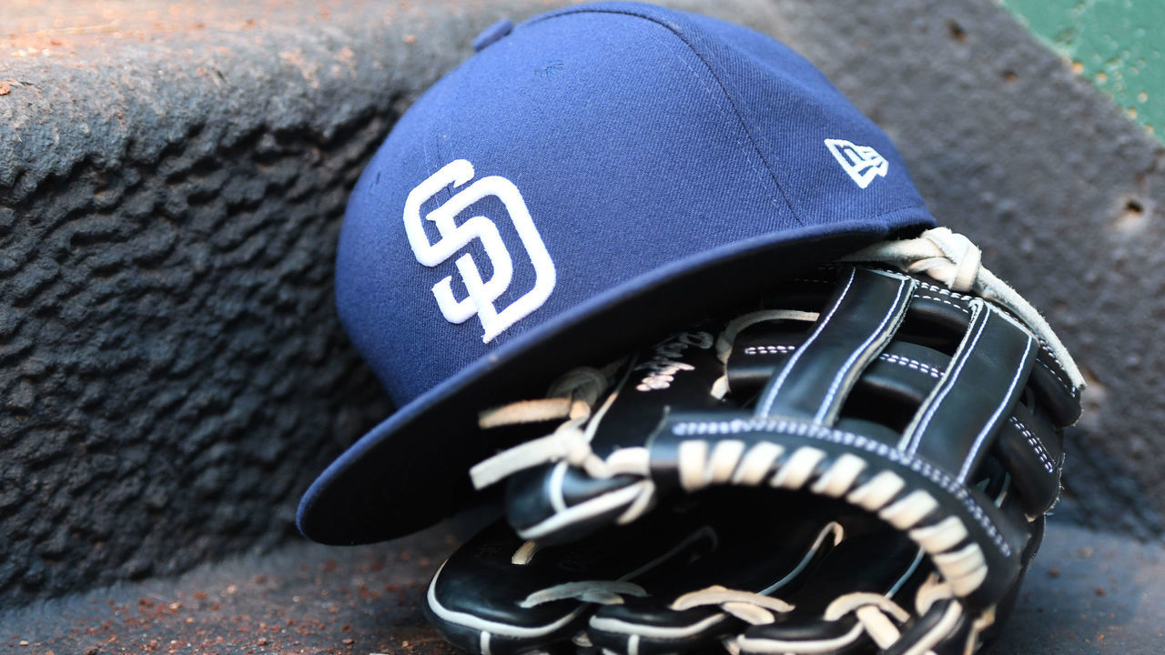 WASHINGTON, DC - MAY 26: A San Diego Padres cap and glove in the dug out during a baseball game against the Washington Nationals at Nationals Park on May 26, 2017 in Washington, DC.