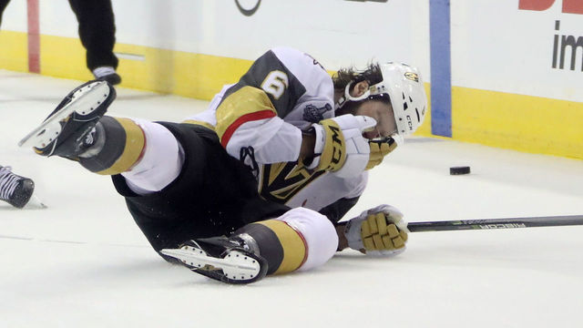 WASHINGTON, DC - JUNE 04: Colin Miller #6 of the Vegas Golden Knights reacts after getting hit by T.J. Oshie (not pictured) #77 of the Washington Capitals during the third period in Game Four of the 2018 NHL Stanley Cup Final at Capital One Arena on June 4, 2018 in Washington, DC.