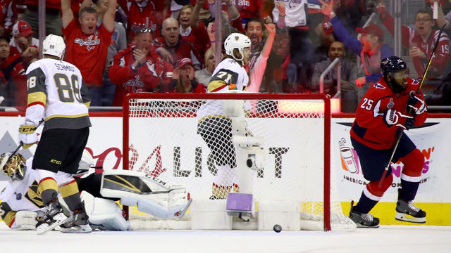 WASHINGTON, DC - JUNE 04: Devante Smith-Pelly #25 of the Washington Capitals celebrates as he scores a first-period goal past Marc-Andre Fleury #29 of the Vegas Golden Knights in Game Four of the 2018 NHL Stanley Cup Final at Capital One Arena on June 4, 2018 in Washington, DC.