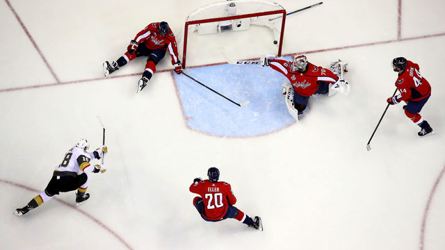WASHINGTON, DC - JUNE 04: Braden Holtby #70 of the Washington Capitals grabs the puck after it hit the post against James Neal #18 of the Vegas Golden Knights during the first period in Game Four of the 2018 NHL Stanley Cup Final at Capital One Arena on June 4, 2018 in Washington, DC.
