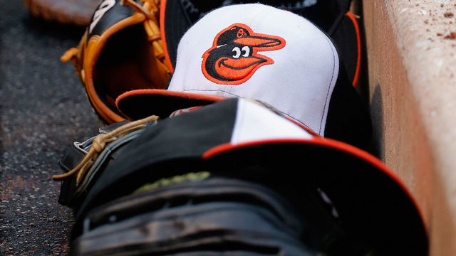 BALTIMORE, MD - JUNE 13: Gloves and hats line the Baltimore Orioles dugout during the Orioles 9-4 win over the New York Yankees at Oriole Park at Camden Yards on June 13, 2015 in Baltimore, Maryland.