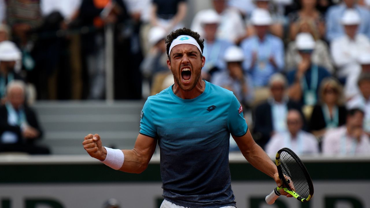 Italy's Marco Cecchinato celebrates after a point against Serbia's Novak Djokovic during their men's singles quarter-final match on day ten of The Roland Garros 2018 French Open tennis tournament in Paris on June 5, 2018.