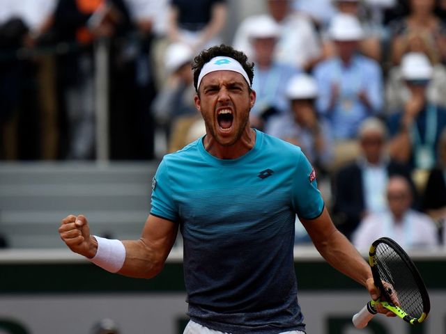 Italy's Marco Cecchinato celebrates after a point against Serbia's Novak Djokovic during their men's singles quarter-final match on day ten of The Roland Garros 2018 French Open tennis tournament in Paris on June 5, 2018.
