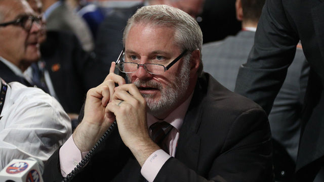 CHICAGO, IL - JUNE 24: General manager Garth Snow of the New York Islanders talks on the phone during the 2017 NHL Draft at United Center on June 24, 2017 in Chicago, Illinois.