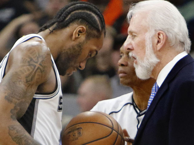 SAN ANTONIO,TX - MARCH 13: Kawhi Leonard #2 of the San Antonio Spurs talks with head coach Gregg Popovic at AT&T Center on March 13, 2017 in San Antonio, Texas. NOTE TO USER: User expressly acknowledges and agrees that , by downloading and or using this photograph, User is consenting to the terms and conditions of the Getty Images License Agreement.