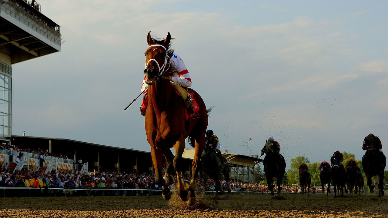 BALTIMORE - MAY 17: Big Brown, ridden by Kent Desormeaux, crosses the finish line to win the 133rd Preakness Stakes at Pimlico Race Course May 17, 2008 in Baltimore, Maryland.