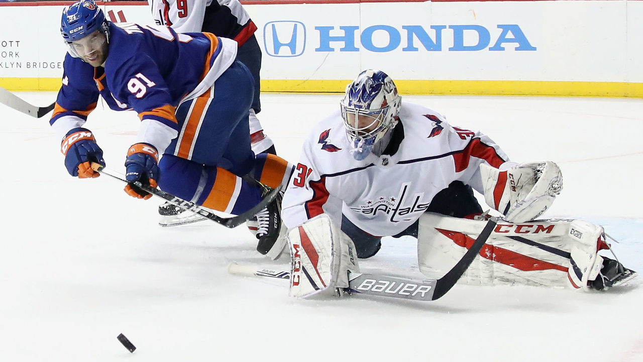 NEW YORK, NY - MARCH 15: John Tavares #91 of the New York Islanders misses a second period attempt against Philipp Grubauer #31 of the Washington Capitals at the Barclays Center on March 15, 2018 in the Brooklyn borough of New York City.