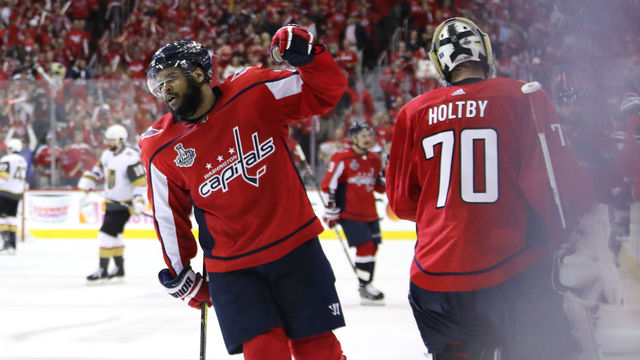WASHINGTON, DC - JUNE 02: Devante Smith-Pelly #25 is congratulated by his teammate Braden Holtby #70 after scoring a third-period goal against the Vegas Golden Knights in Game Three of the 2018 NHL Stanley Cup Final at Capital One Arena on June 2, 2018 in Washington, DC.