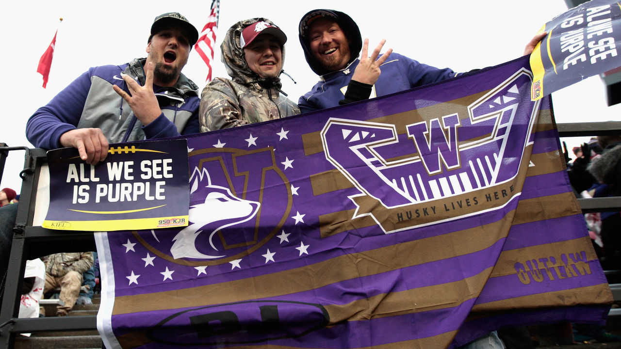PULLMAN, WA - NOVEMBER 25: Fans for the Washington Huskies cheer for their team against the Washington State Cougars in the second half of the 109th Apple Cup at Martin Stadium on November 25, 2016 in Pullman, Washington. Washington defeated Washington State 45-17.