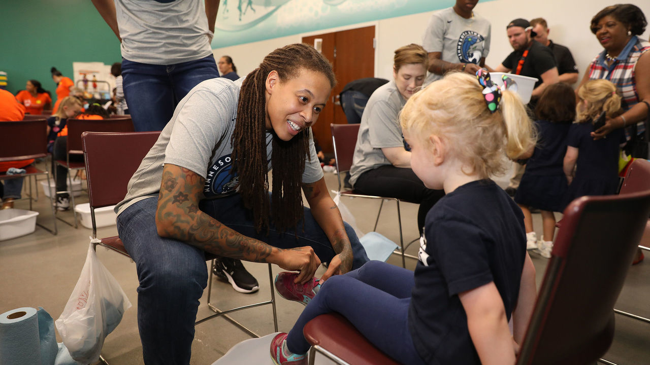 WASHINGTON, DC - JUNE 6: Seimone Augustus #33 of the Minnesota Lynx participates in a community event giving away shoes and socks at Payne Elementary in Washington, DC on Jun 6, 2018. NOTE TO USER: User expressly acknowledges and agrees that, by downloading and/or using this photograph, user is consenting to the terms and conditions of the Getty Images License Agreement. Mandatory Copyright Notice: Copyright 2017 NBAE
