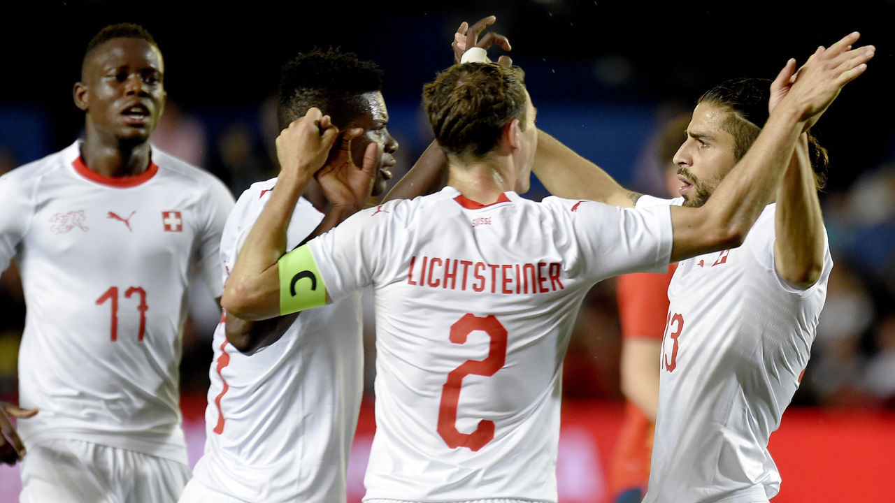 Switzerland's defender Ricardo Rodriguez (R) celebrates a goal with teammates during the international friendly football match between Spain and Switzerland at La Ceramica stadium in Vila-real on June 3, 2018.