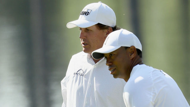AUGUSTA, GA - APRIL 03: Tiger Woods and Phil Mickelson of the United States talk during a practice round prior to the start of the 2018 Masters Tournament at Augusta National Golf Club on April 3, 2018 in Augusta, Georgia.