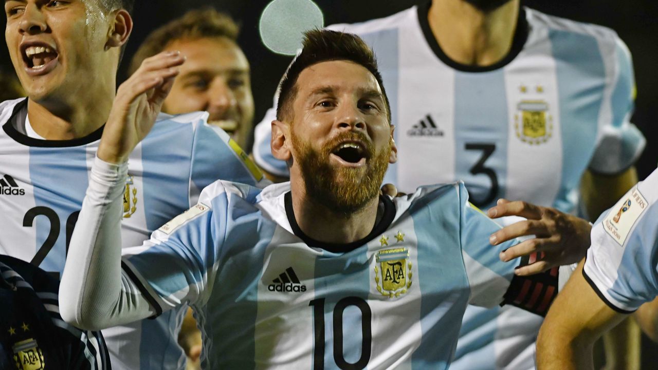 Argentina's Lionel Messi (C) celebrates after defeating Ecuador and qualifying to the 2018 World Cup football tournament, in Quito, on October 10, 2017. / AFP PHOTO / Juan Ruiz