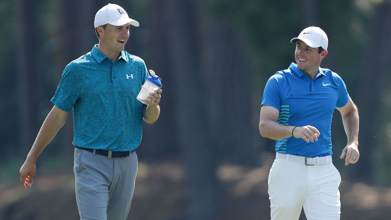 PONTE VEDRA BEACH, FL - MAY 11: Jordan Spieth of the United States and Rory McIlroy of Northern Ireland walk on the tenth hole during the second round of THE PLAYERS Championship on the Stadium Course at TPC Sawgrass on May 11, 2018 in Ponte Vedra Beach, Florida.